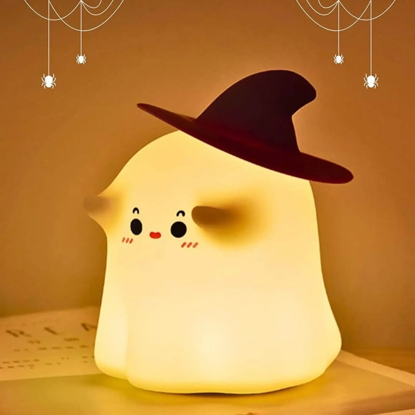 Cute ghost night light with a witch hat, glowing softly, ideal for home Halloween decor.