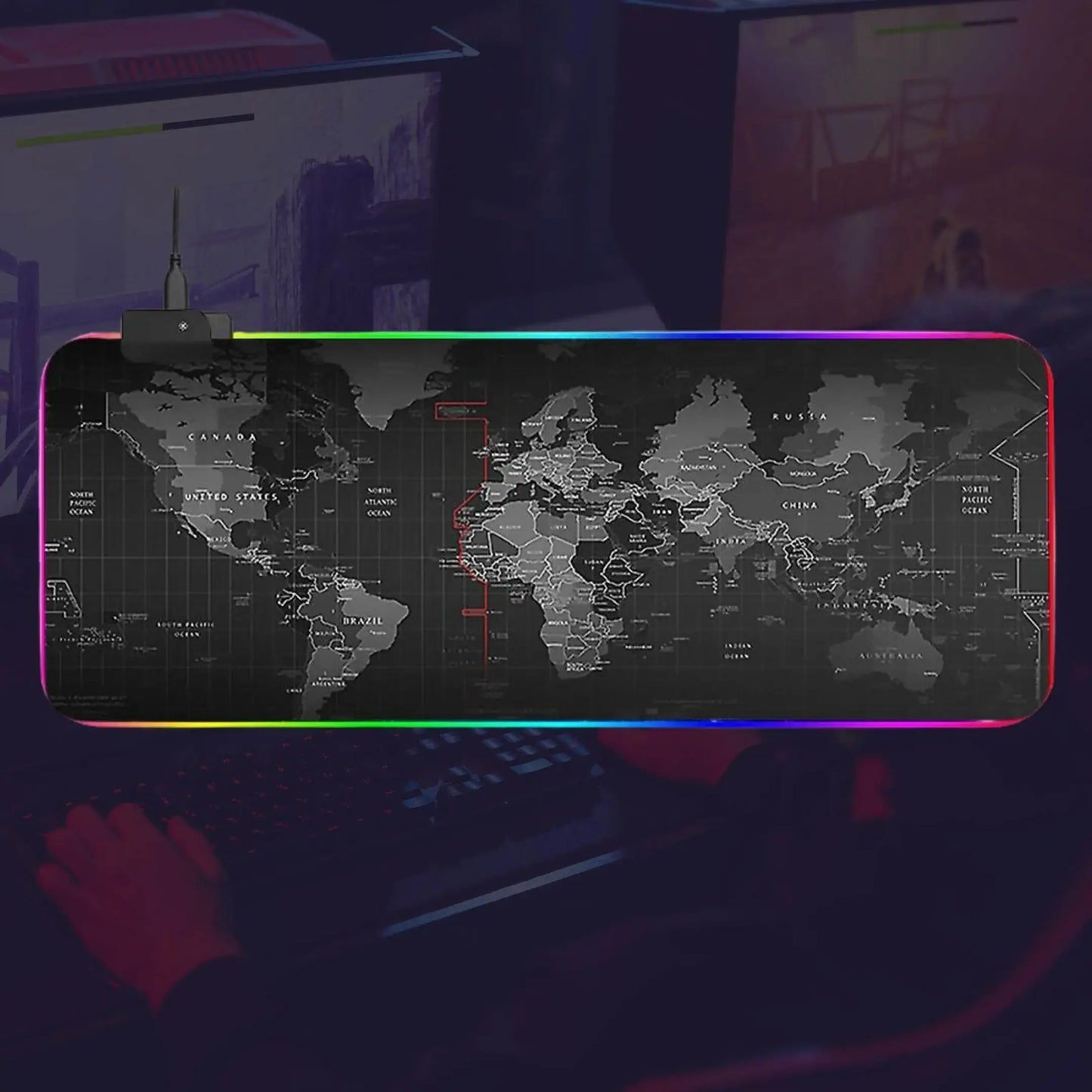 Large RGB gaming mouse pad with world map design on a dark computer desk setup