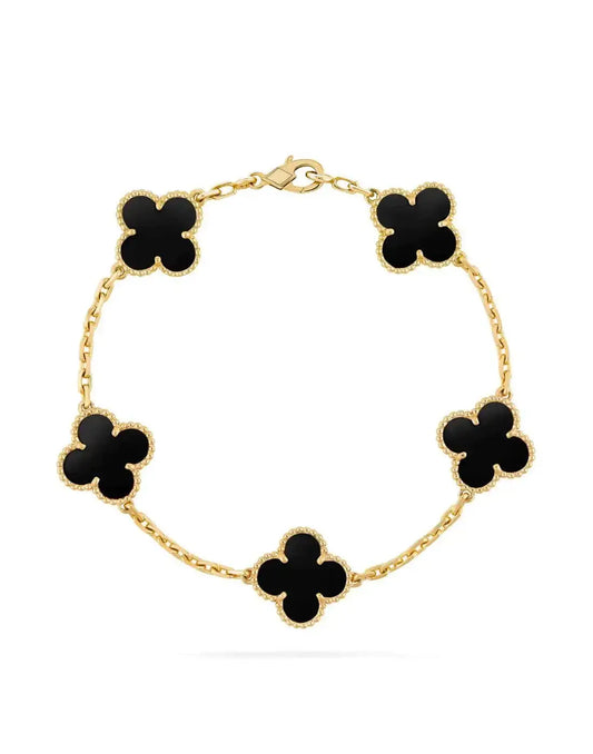 Gold chain bracelet with black four-leaf clover charms, elegant fashion jewelry accessory
