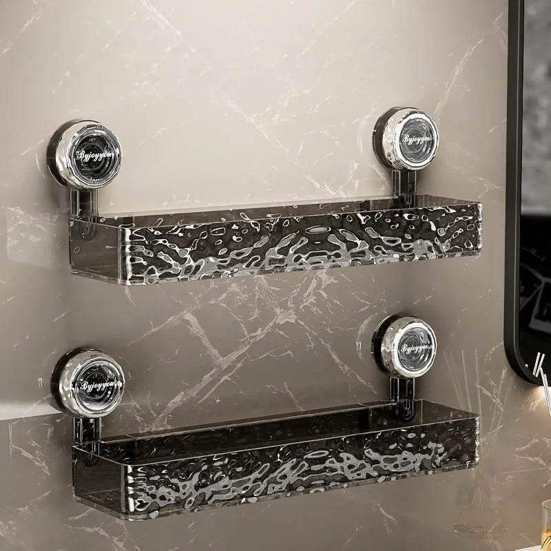 Black wall-mounted bathroom shelves with marble textured finish and suction cup installation.