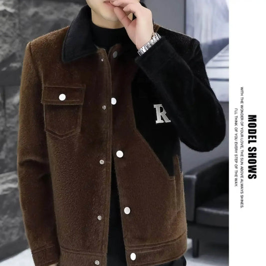 Man wearing brown and black faux fur jacket with letter R patch, modern indoor setting