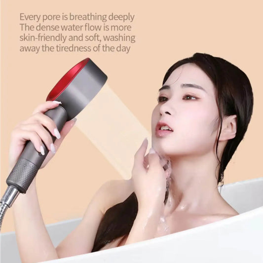 Woman using a handheld high-pressure shower head in a bathtub for relaxing skincare