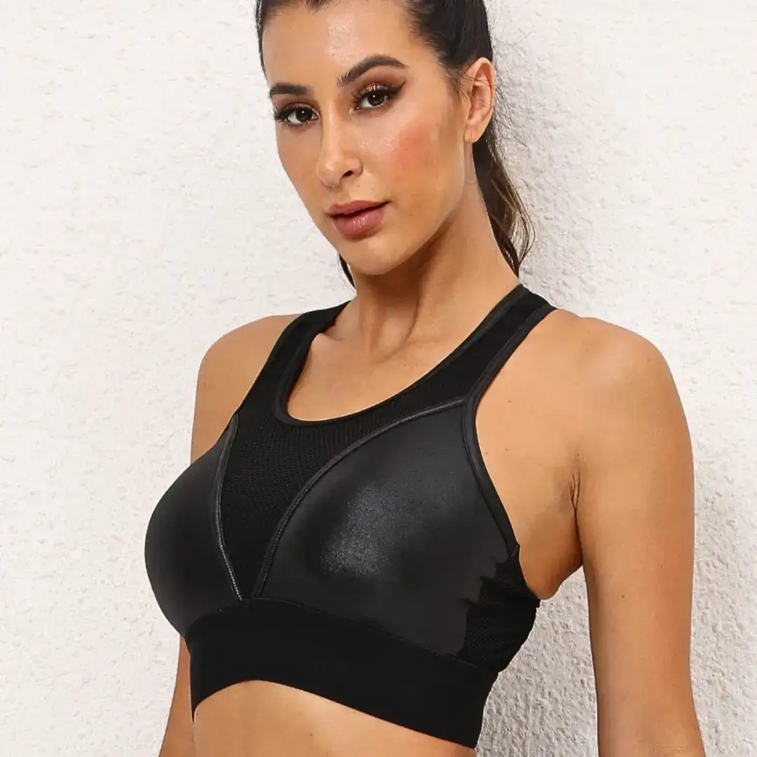 Woman modeling sleek black sports bra, fitness fashion, Strike Algo trending essentials