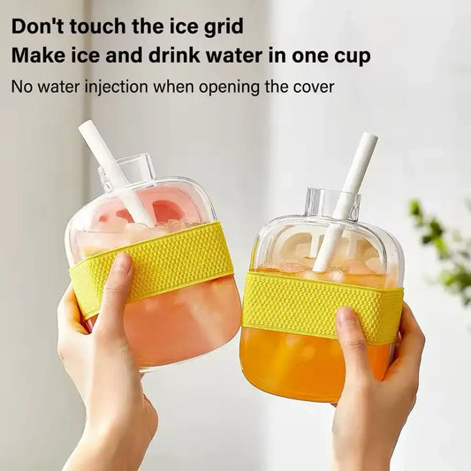 Hands holding dual-purpose clear water bottles with built-in ice grid, large straws, and yellow grip bands.